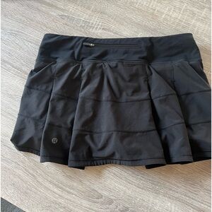 Lululemon athletic skirt. Washed, but never wore it. Zipper pocket in back.